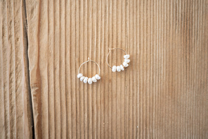 pearl earrings.